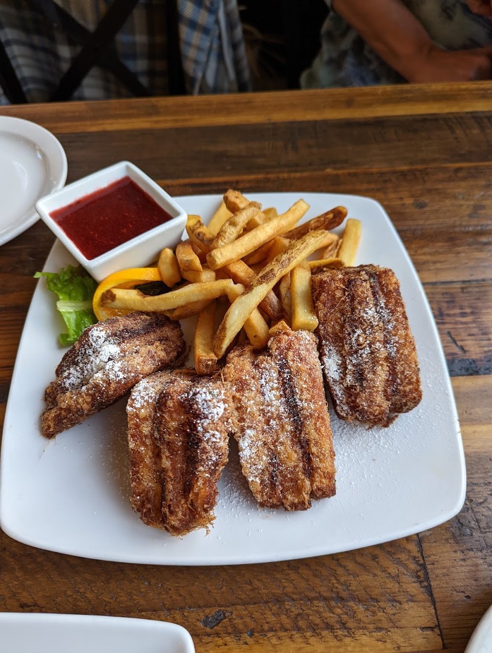 Printed menu featuring entrées, sandwiches, and desserts.
